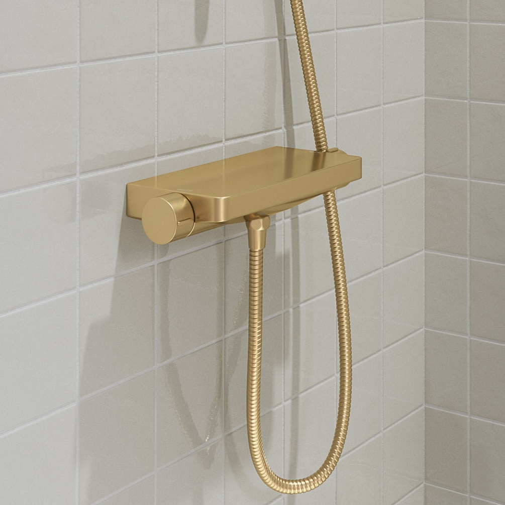 Close up lifestyle image of the Britton Hoxton Brushed Brass Thermostatic Shower Valve